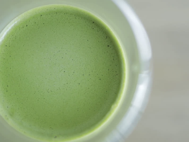 Green matcha latte in a ceramic cup